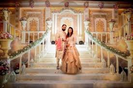 a man and woman standing on stairs